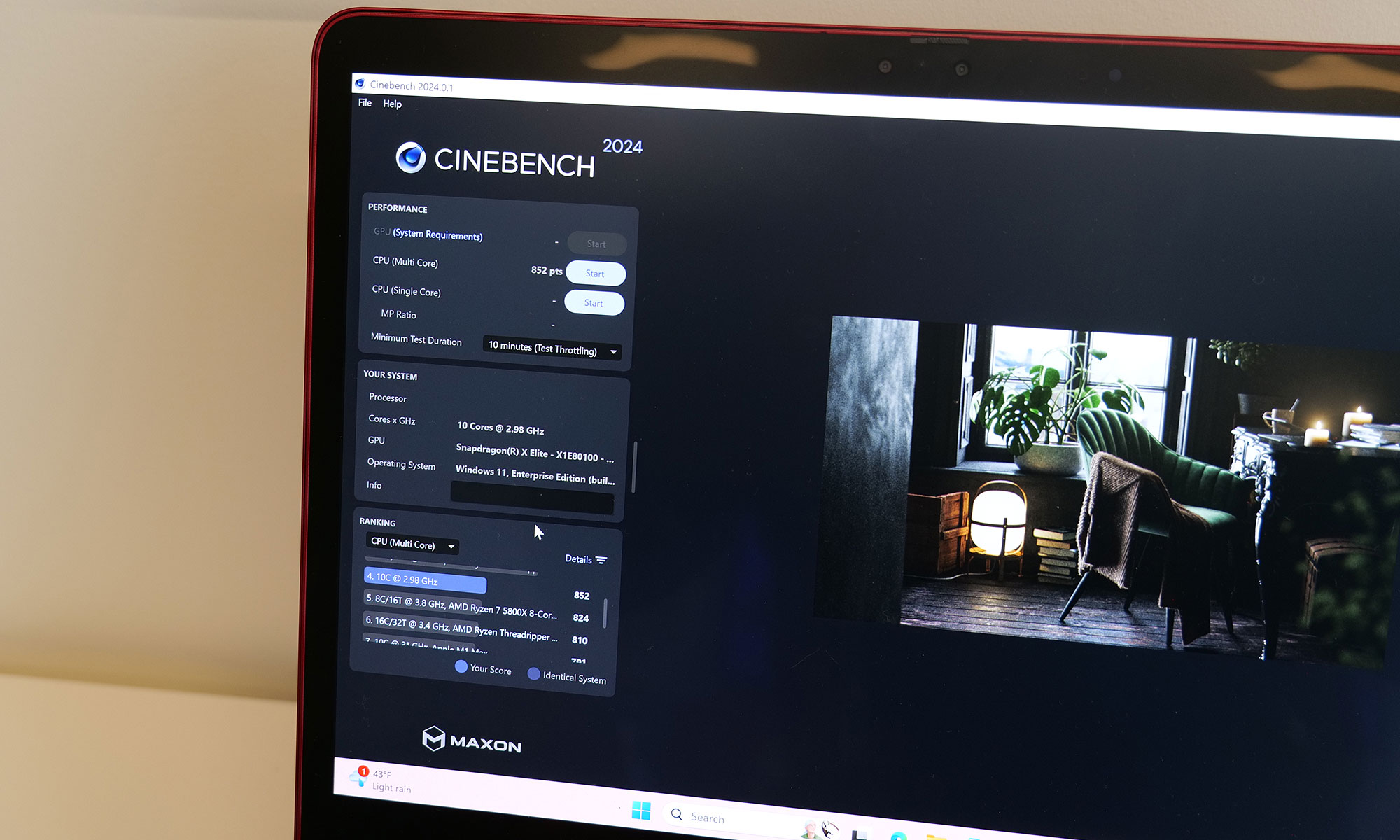 A photo of the Snapdragon X Plus hitting 852 on Cinebench 2024's multi-core CPU test. 