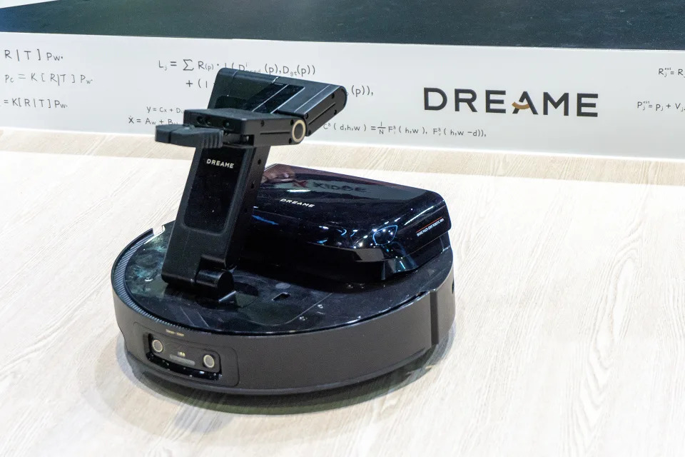 Dreame's prototype robot vacuum with its retractable arm extended.