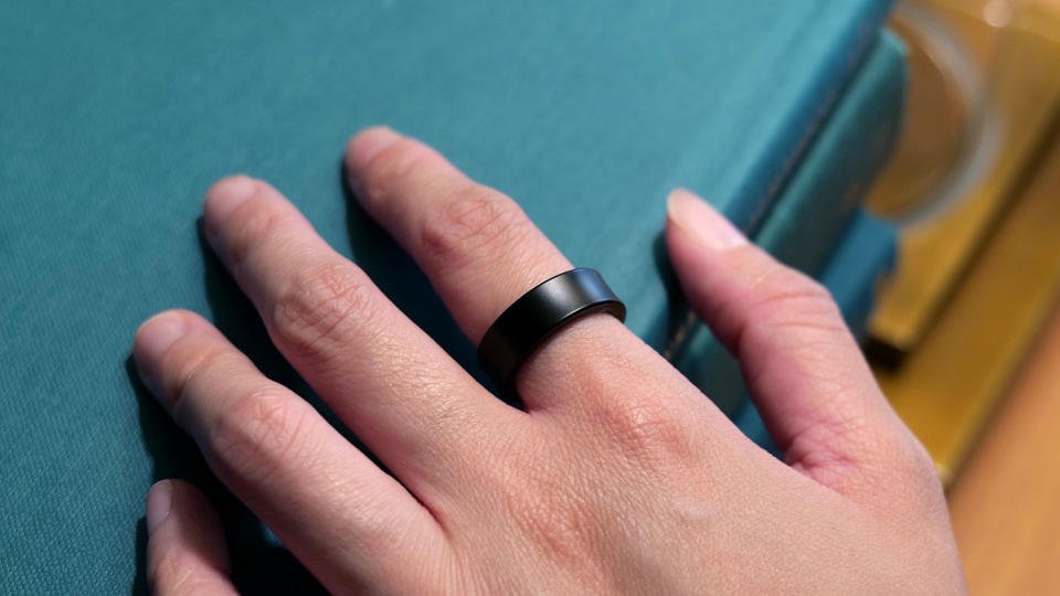 A hand wearing the Samsung Galaxy Ring.