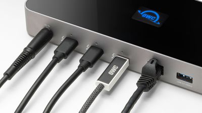 Close-up showing OWC’s active optical cable plugged into a Thunderbolt hub.