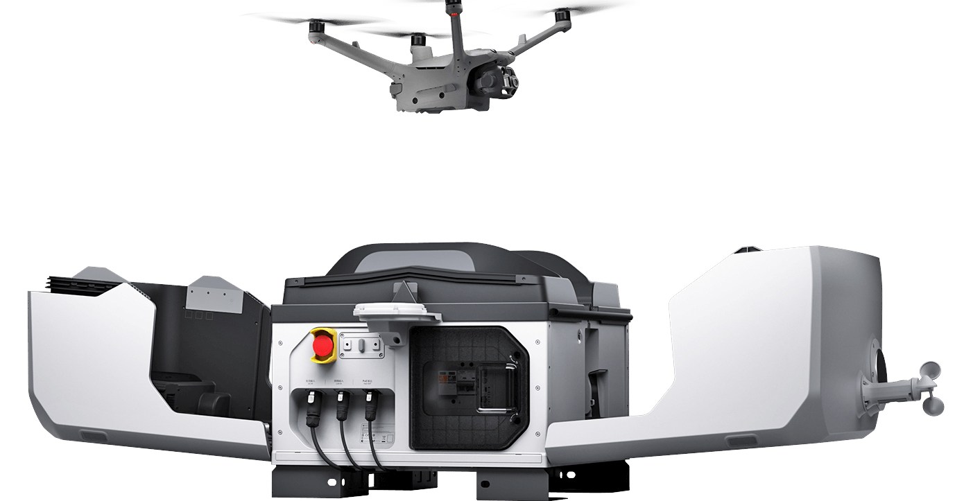 A drone hovering over the DJI Dock 3.