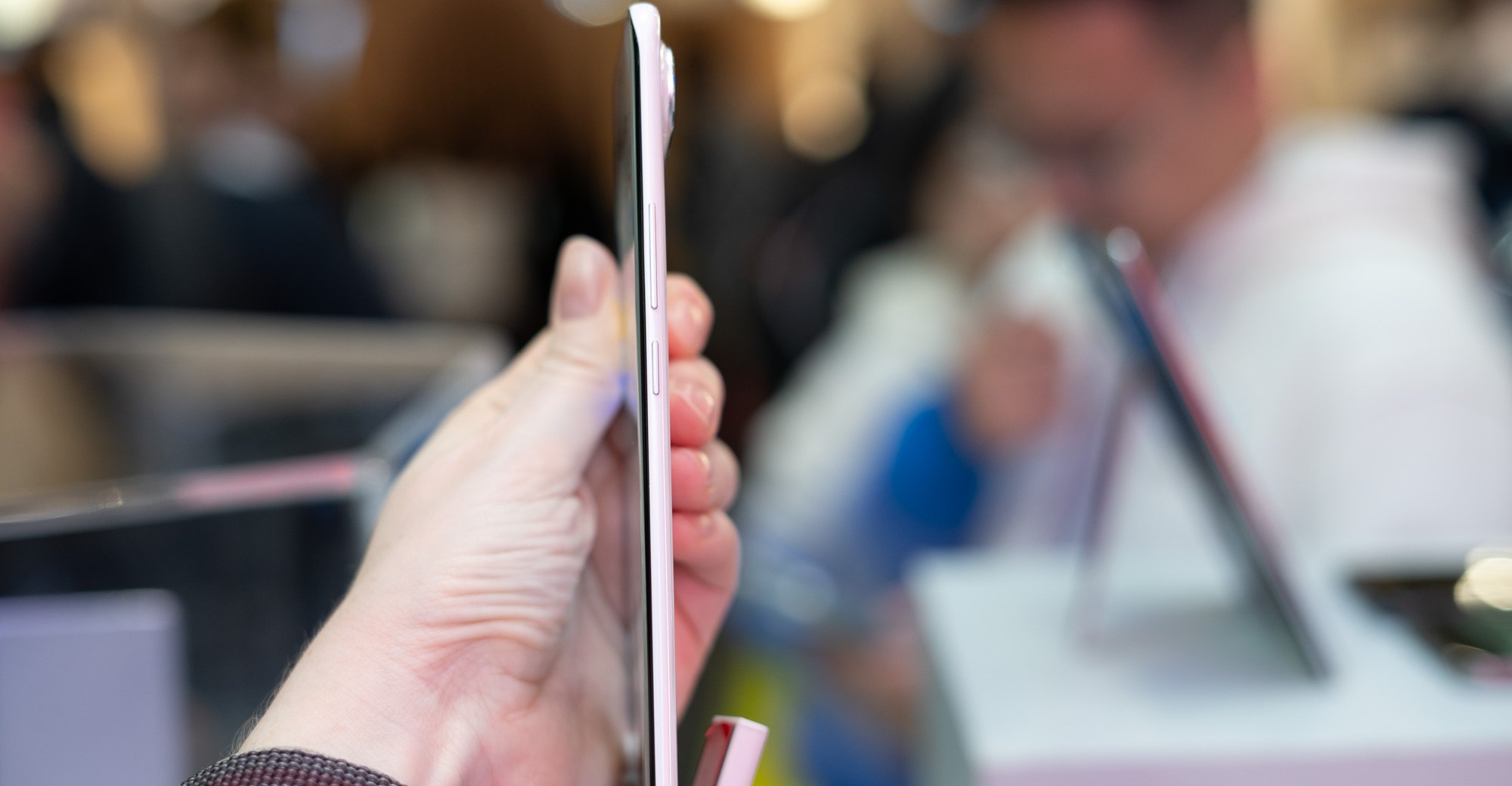 The Tecno Spark Slim concept phone being held sideways to demonstrate how thin it is.