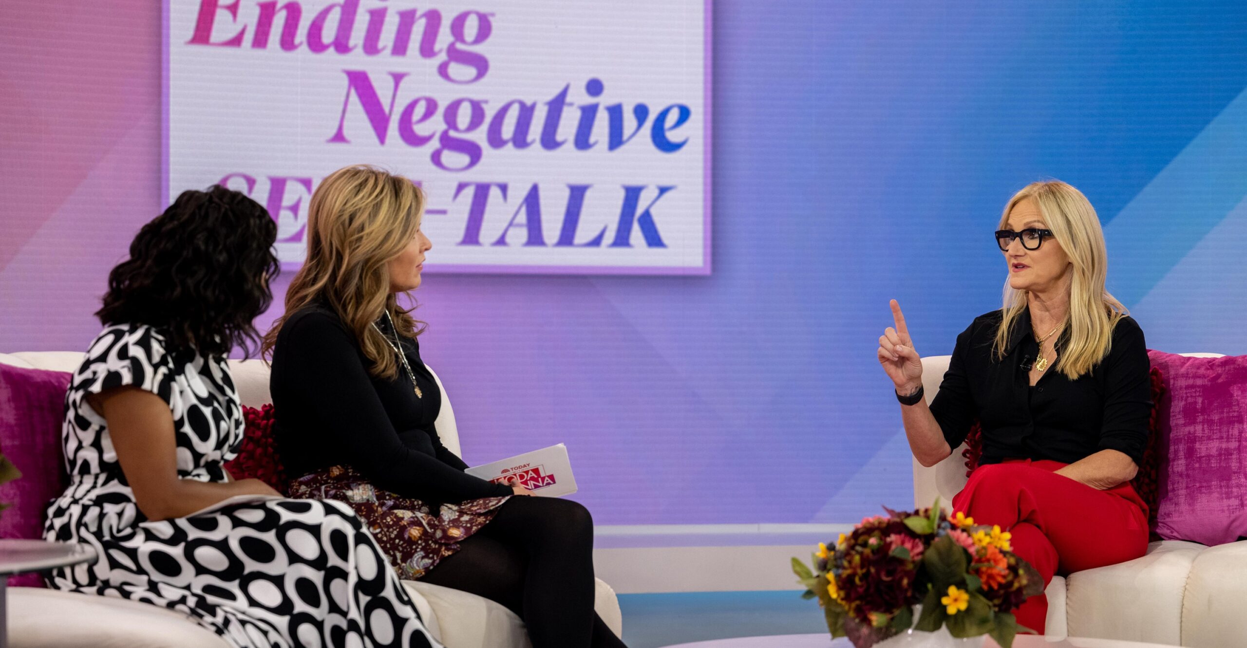 Hosts Sheinelle Jones and Jenna Bush Hager listen to Mel Robbins speak on the Today show