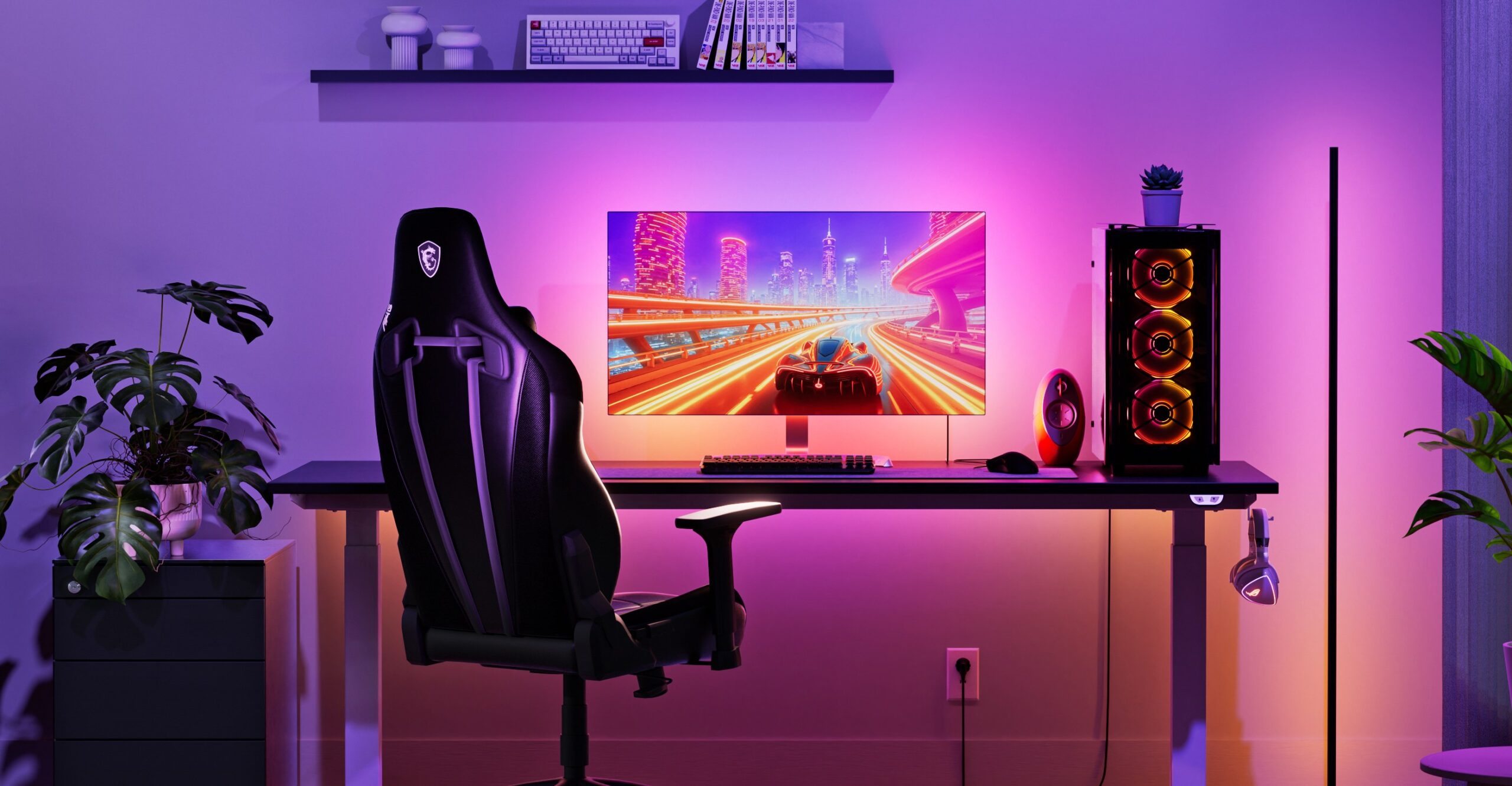 A gaming PC surrounded by an immersive pink and orange glow.