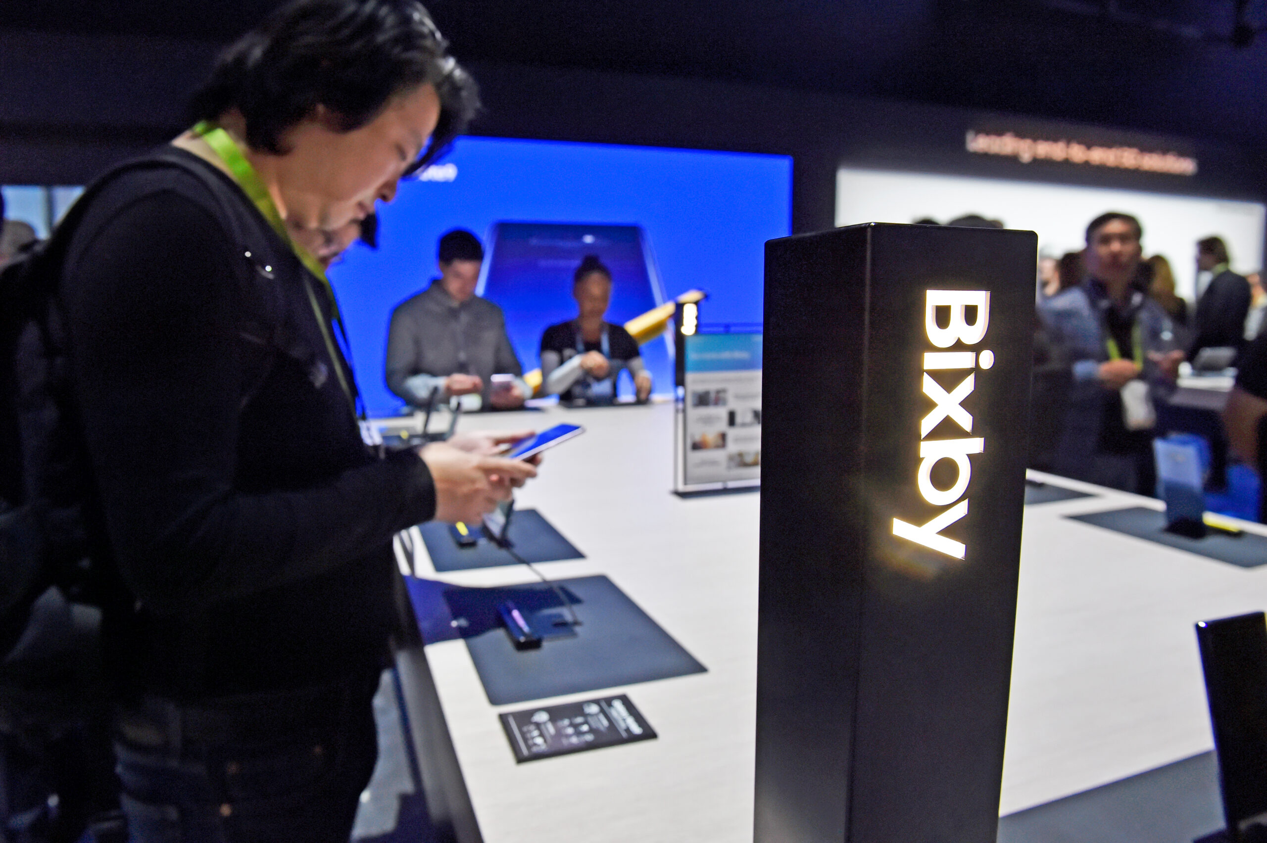 A person testing out software features at a Bixby demo area.