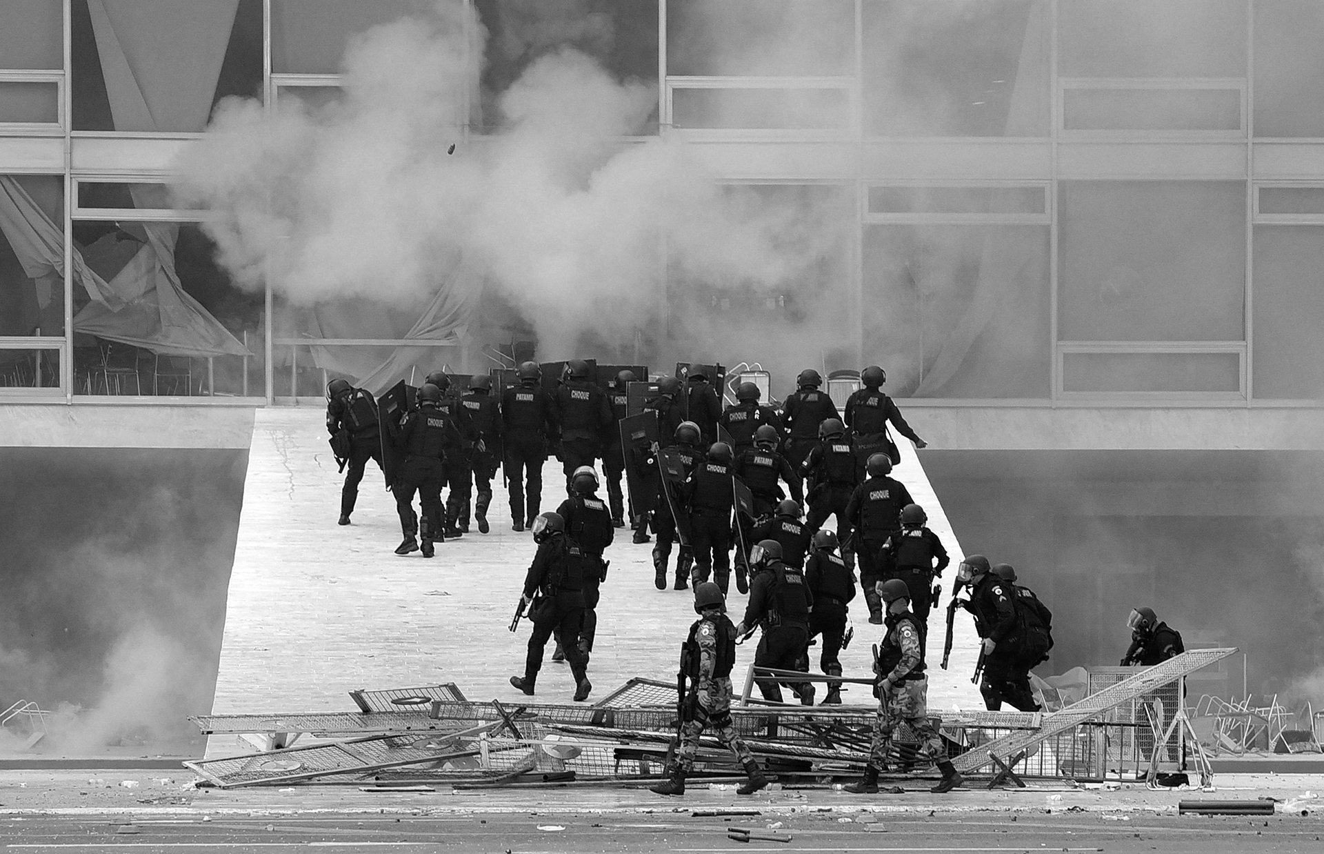 Police going through barricades, which had been destroyed.