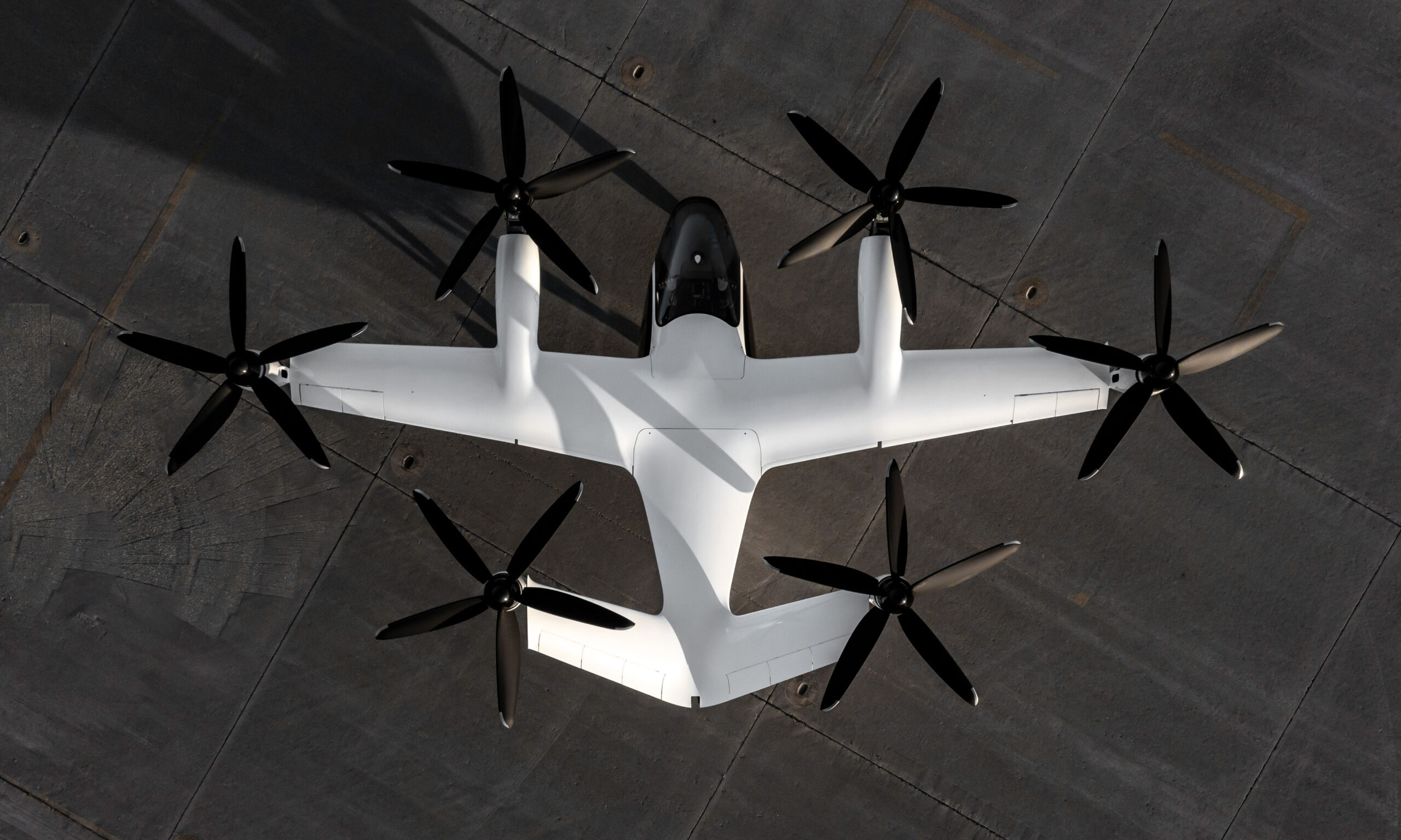View from above of a Joby air taxi sitting on the ground
