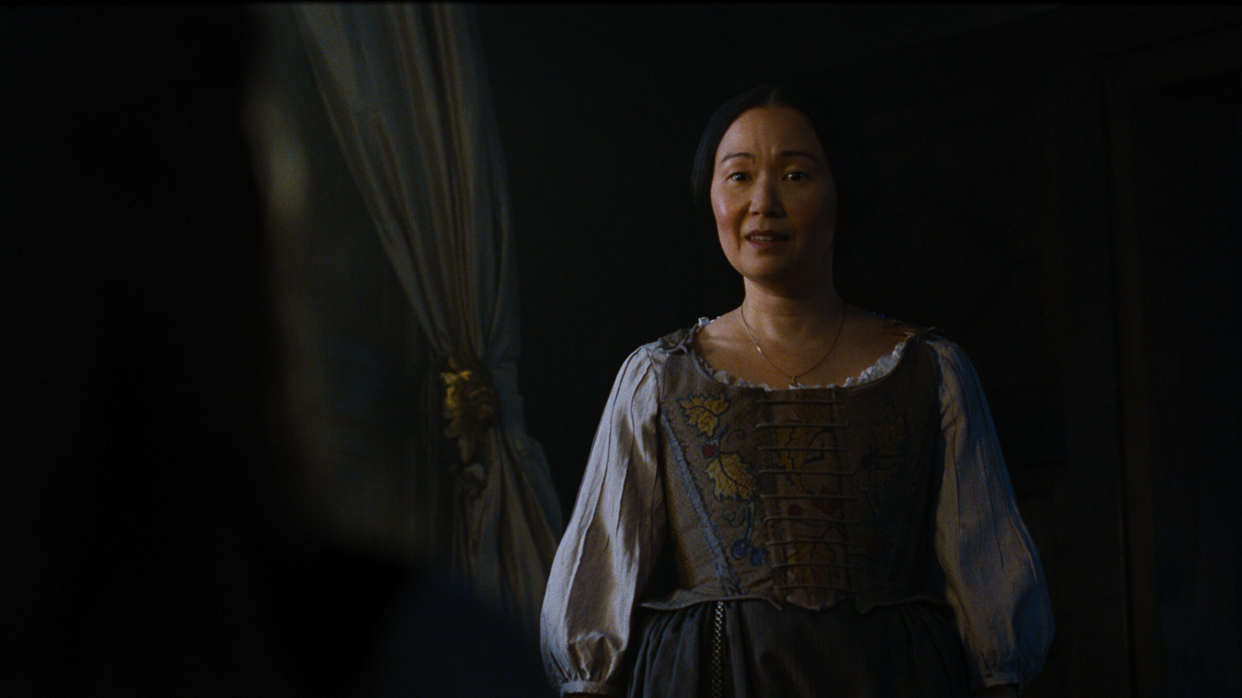 Hong Chua as Nelly Dean in Emerald Fennell’s Wuthering Heights.