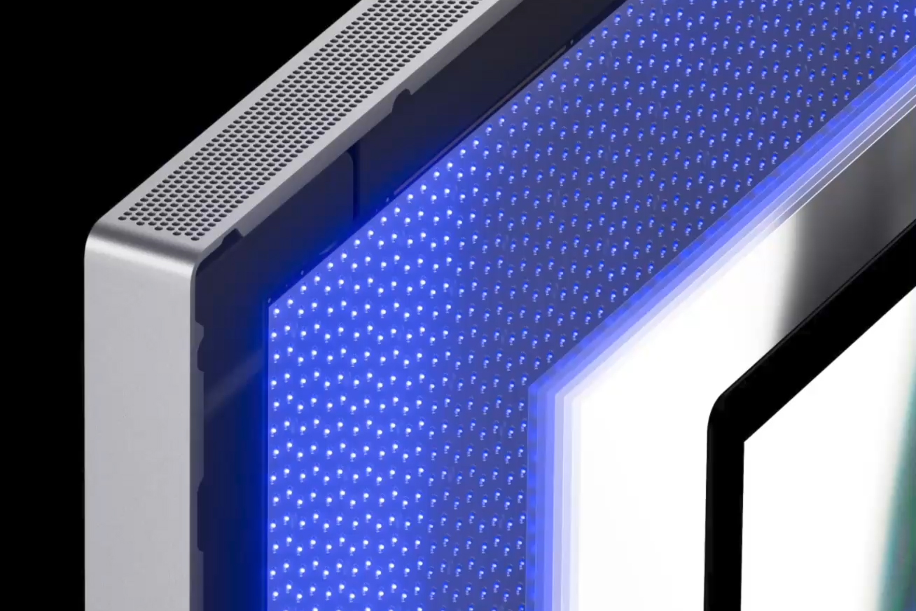 A close up picture showing the separated layers inside Apple's Studio Display XDR monitor and the LEDs inside its backlight panel.