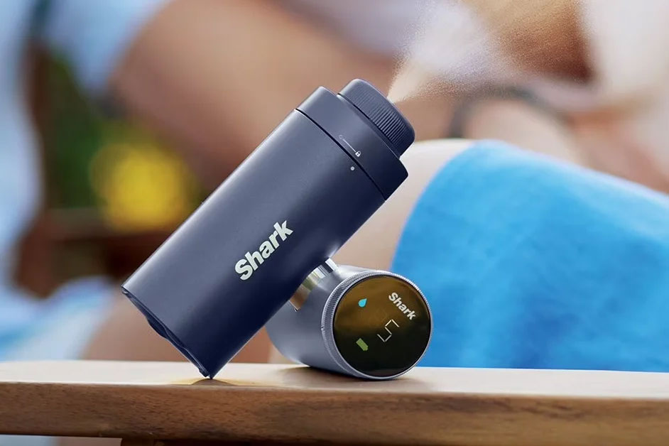 The Shark ChillPill propped up on a table blasting a fine mist.