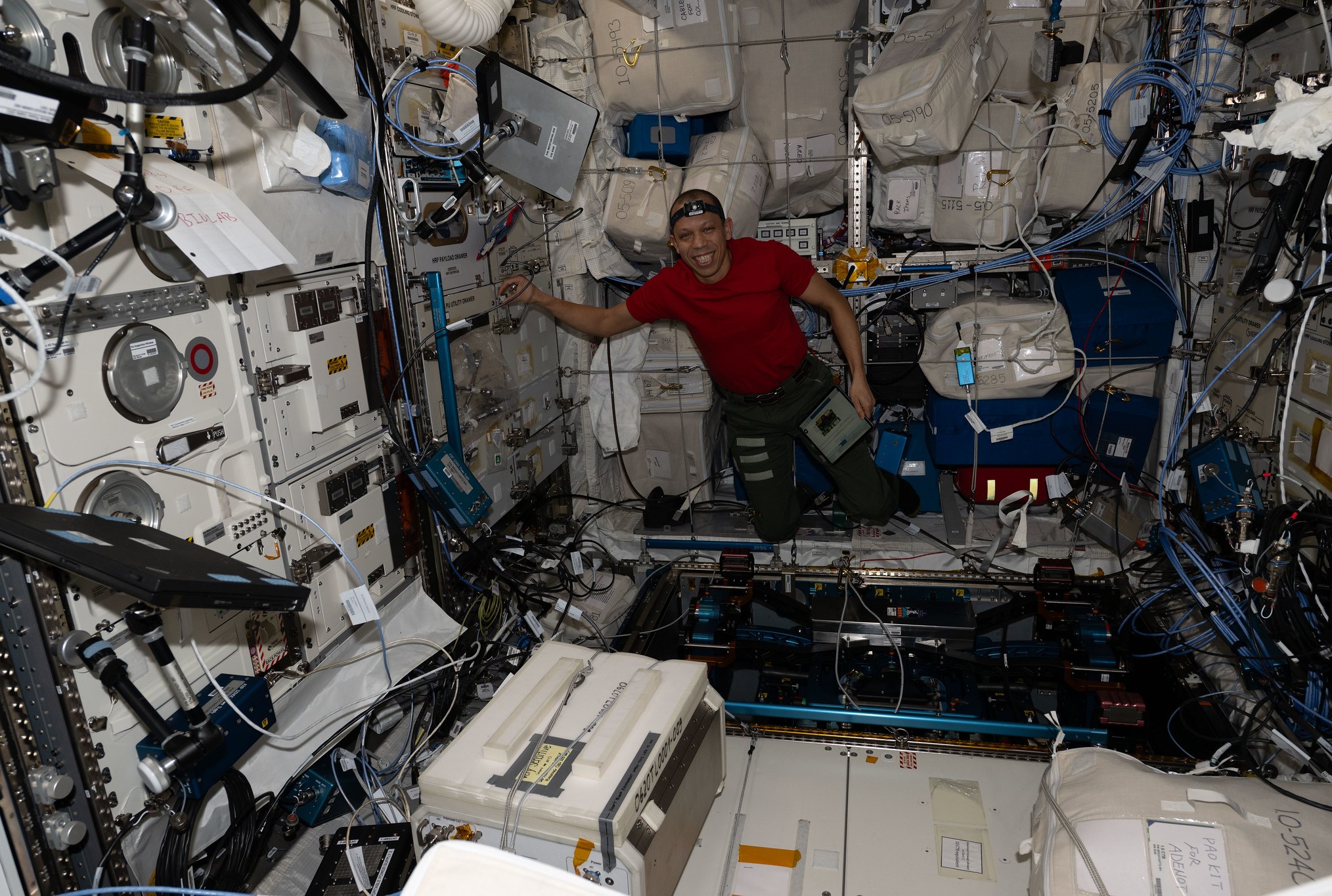 NASA astronaut Chris Williams unpacks computer hardware on the ISS on April 15th, 2026.