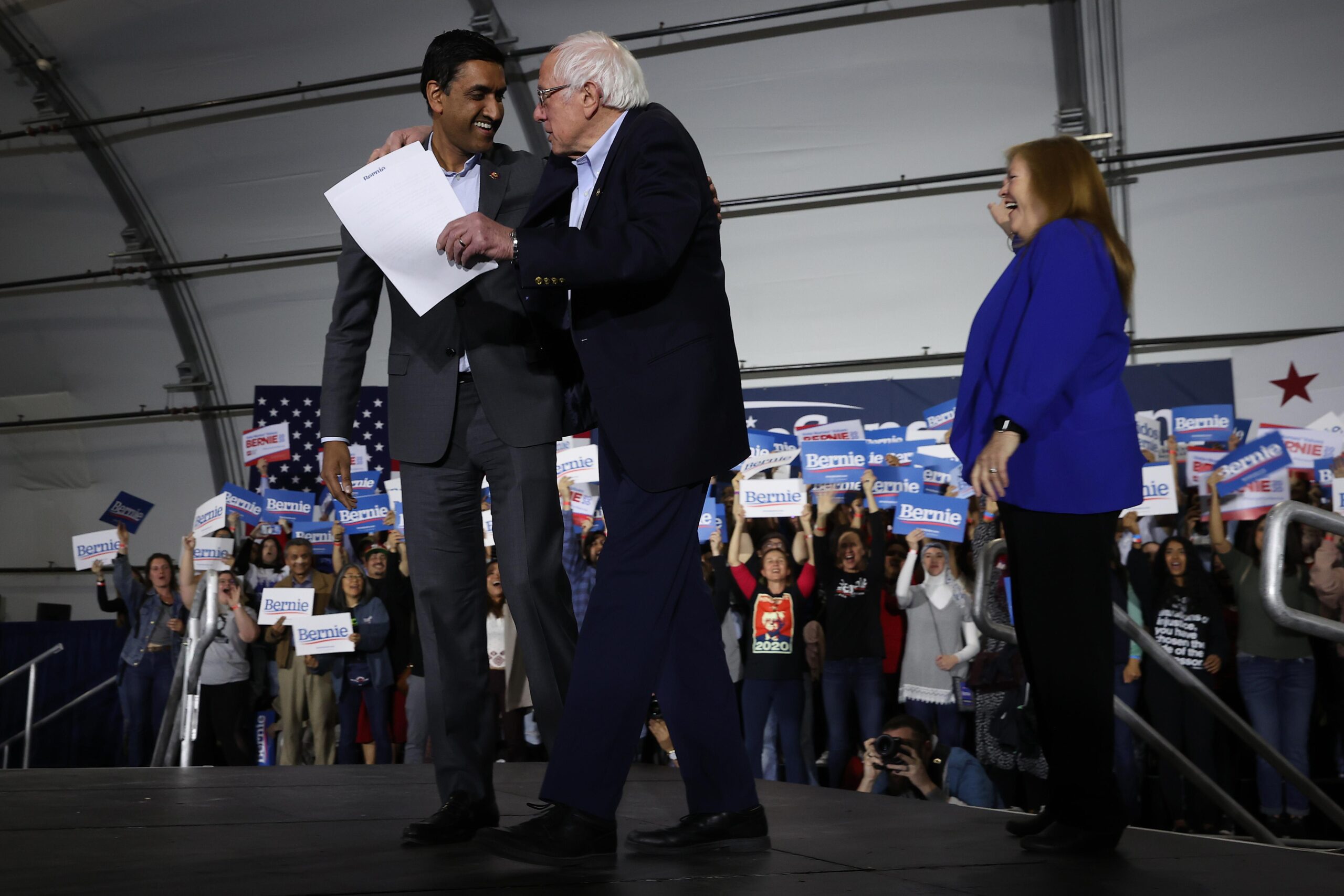 Bernie Sanders embracing Ro Khanna at a rally