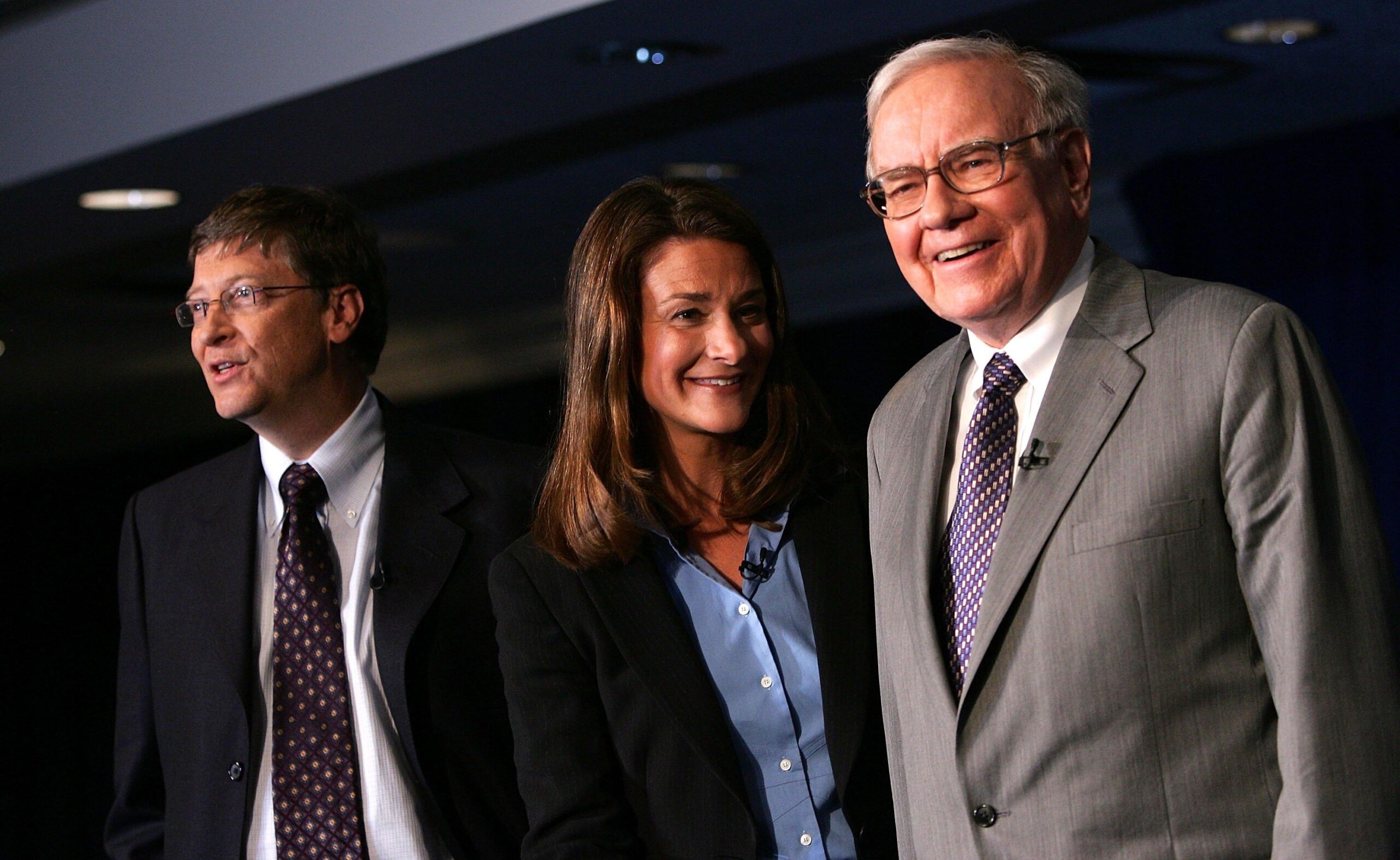 Bill Gates, Melinda French Gates, and Warren Buffett smiling