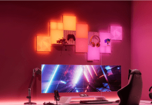 Nanoleaf blocks mounted on a wall above a desk and monitor.