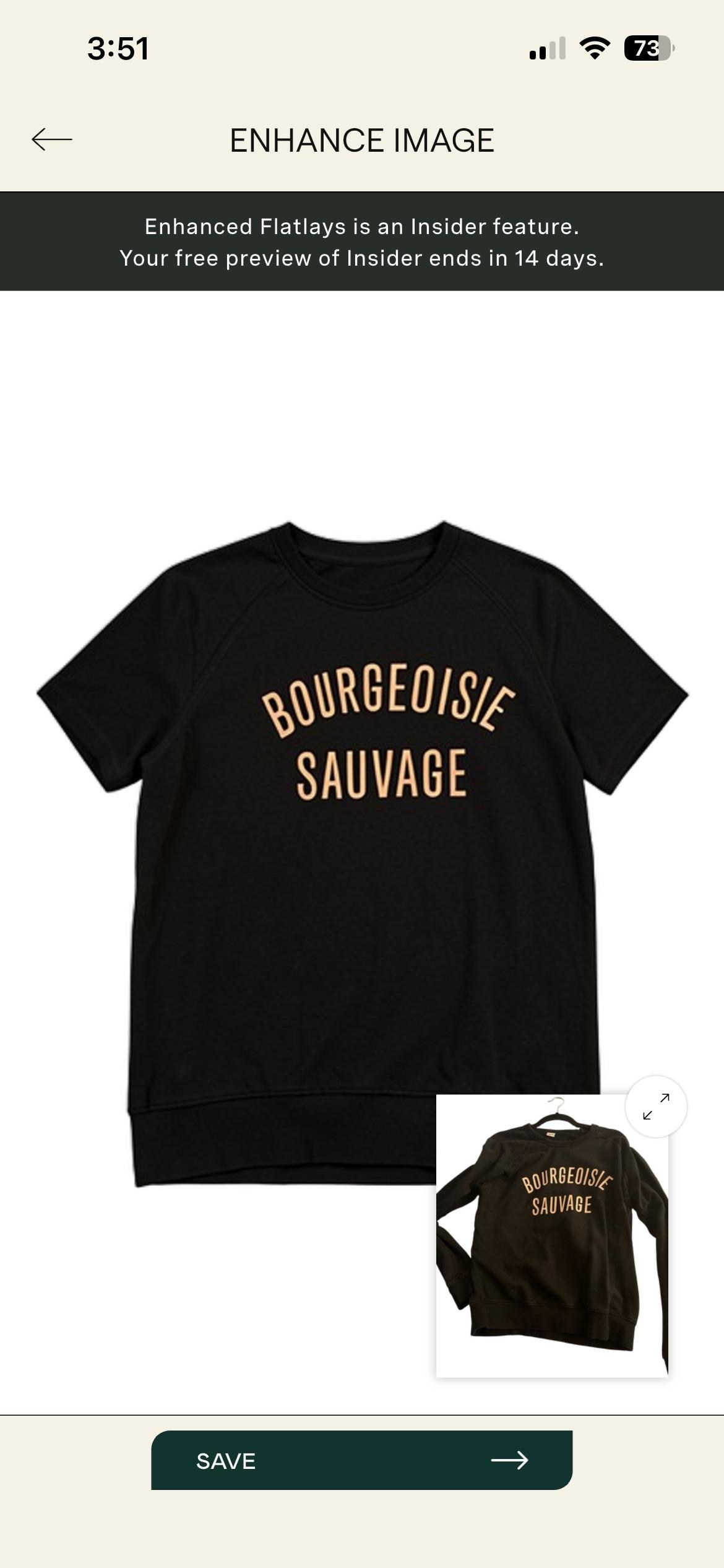 A photo of a black t-shirt with the phrase BOURGEOISIE SAUVAGE written in yellow print.