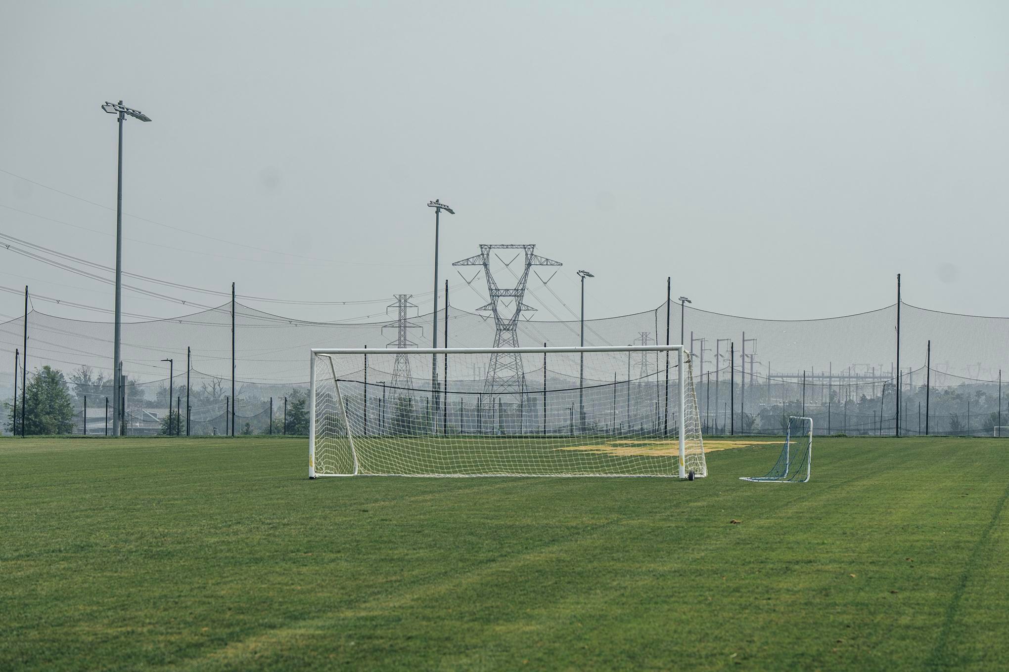 A soccer goal post at Hal and Berni Hanson Regional Park with transmission towers in the background.