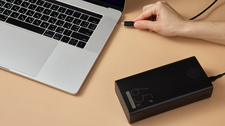 How powerful of a power bank do you need to safely charge a laptop?