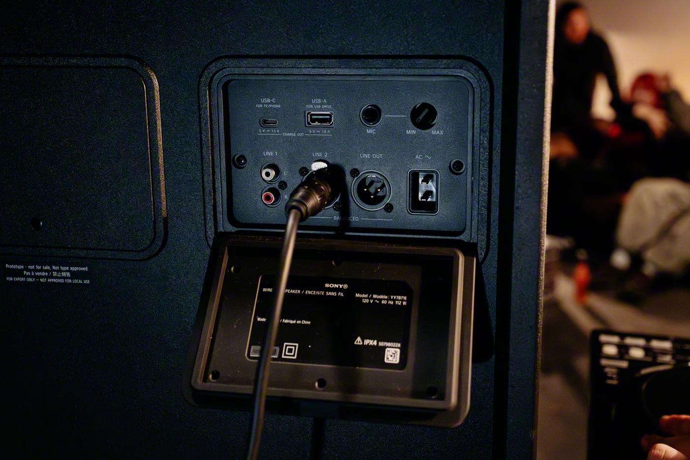 An access panel open on the back of the Sony ULT Tower 7 speaker showing various ports.